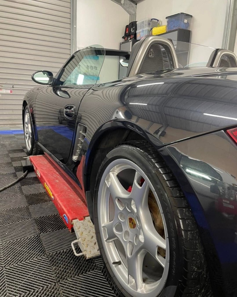 Porsche Boxster and detailed alloy wheel on the ramp