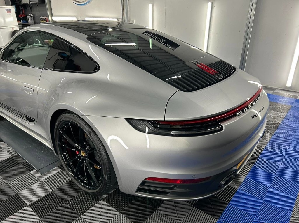 Silver Porsche 911 rear quarter after a paint enhancement