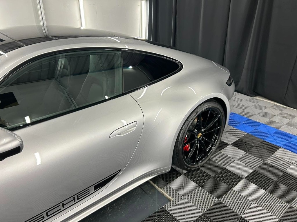 Silver Porsche 911 side profile with a deep gloss finish