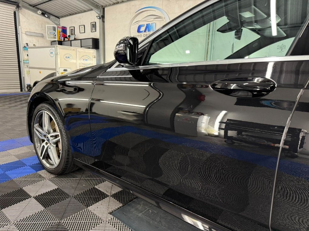Black BMW side profile with a mirror-gloss finish