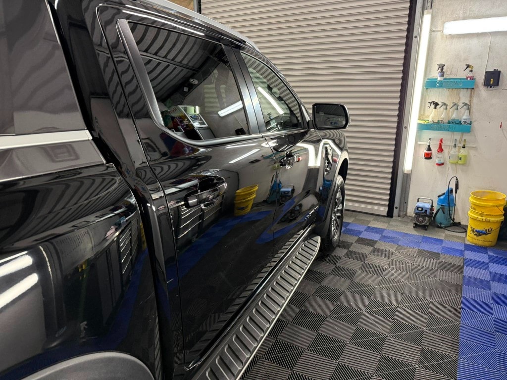 Black pickup truck detailed and protected