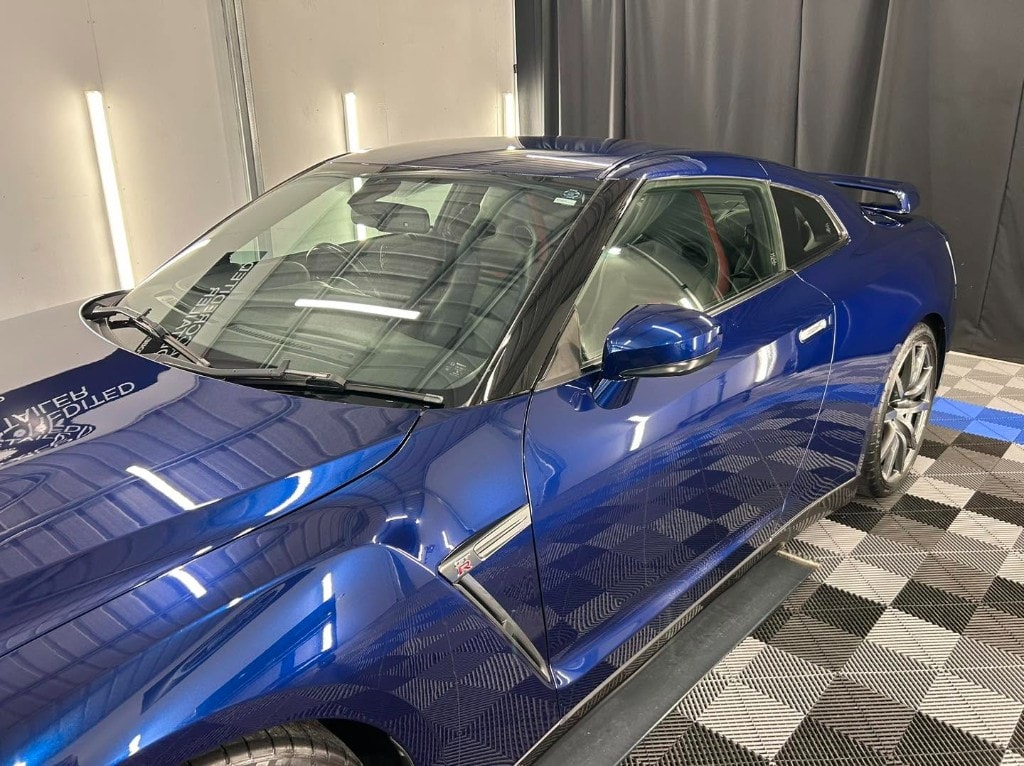 Blue Nissan GT-R front quarter with a flawless gloss