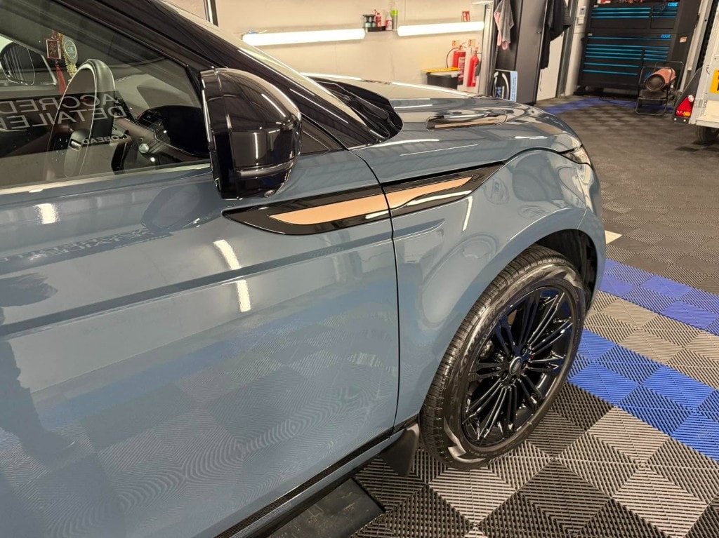 Blue Range Rover Evoque front wing and coated alloy wheel