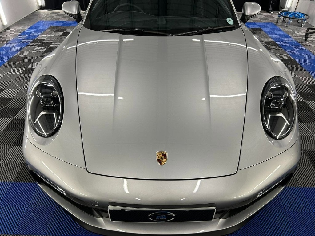 Silver Porsche 911 front end with a flawless finish