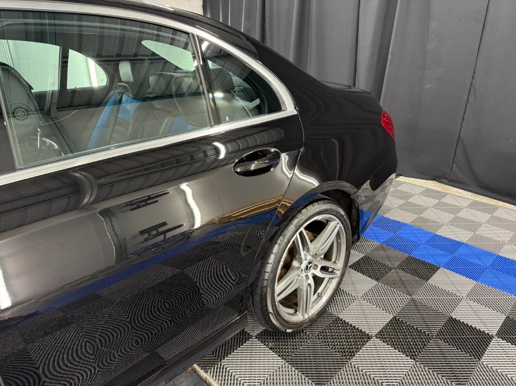 Black Mercedes-Benz rear quarter and coated alloy wheel