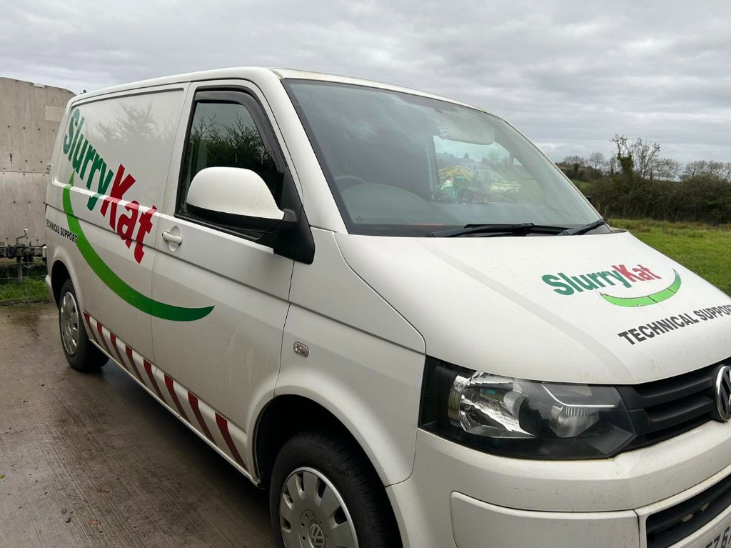Dirty liveried VW Transporter before valeting